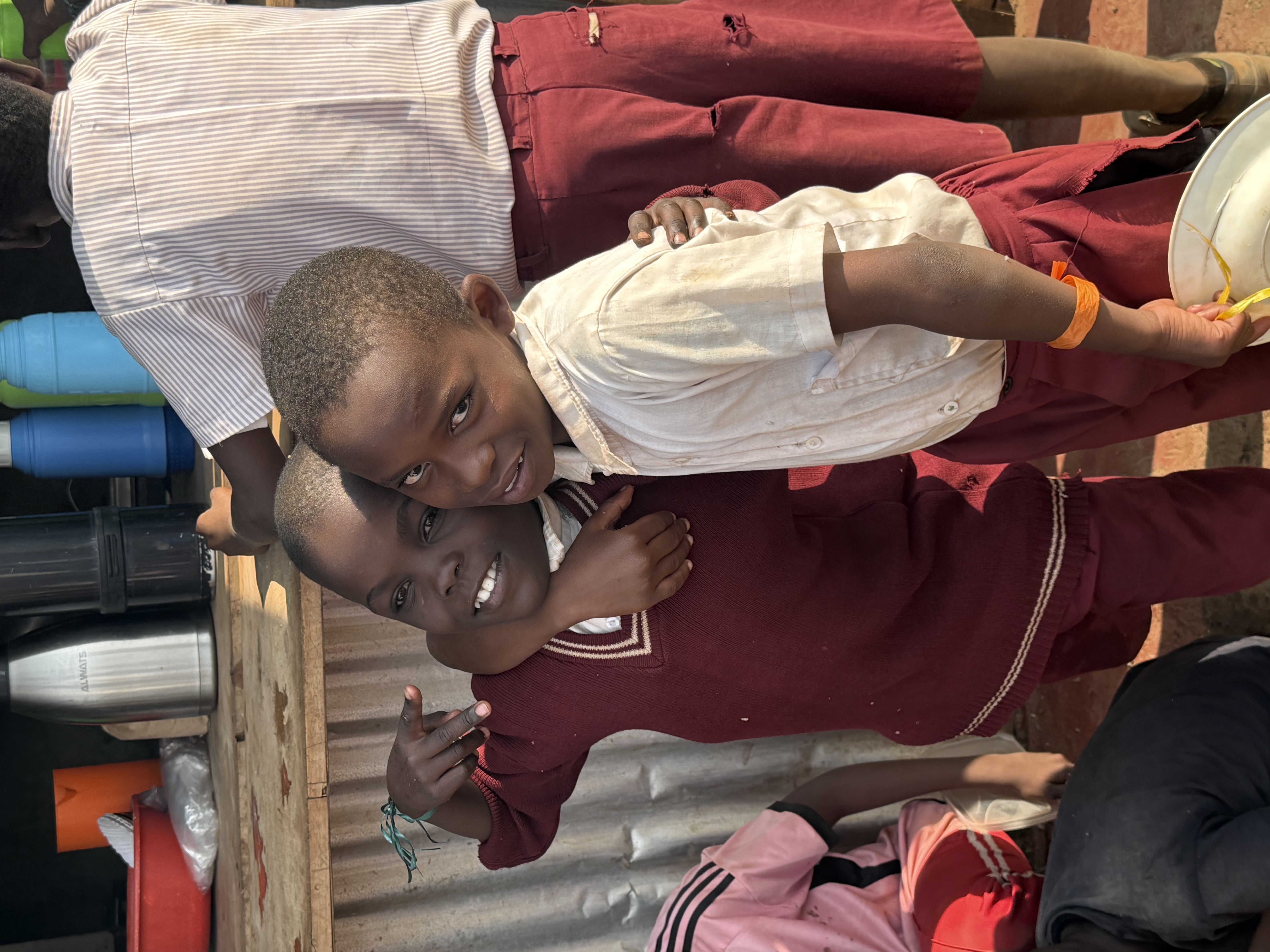 Children hugging at event